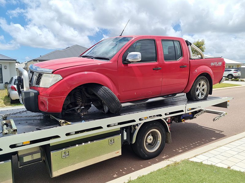 red car being towed by a1 towing services